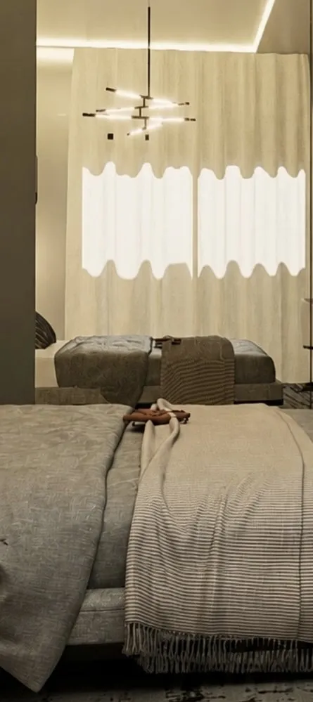 Suíte com cama e iluminação indireta